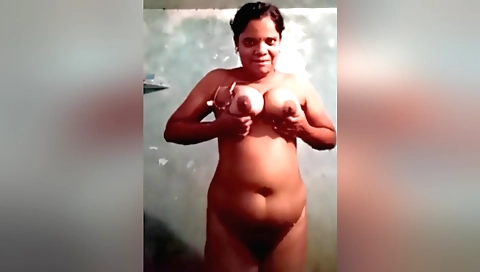 Sexy brunette milf gets naked and fucks herself in the shower