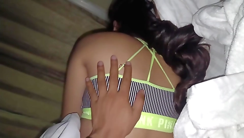 Blonde hussy giving handjob to a handsome guy in her room