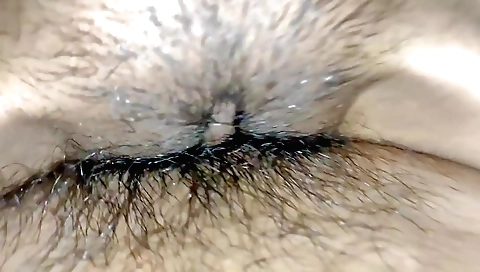 Indian girl with a hairy pussy enjoys fucking in bed