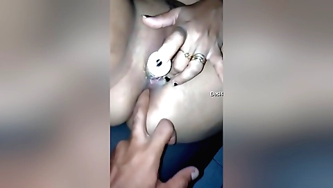 Lesbian threesome with a toy and a dildo on the bed