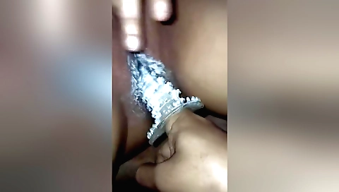 Indian girl in white dress gives pleasure using toy