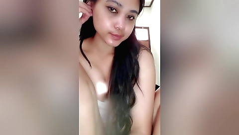 Indian girl playing with her phone in the solo video